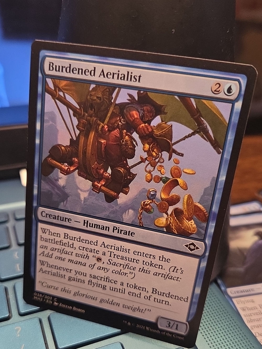 Burdened Aerialist - Blue Magic: The Gathering Card
